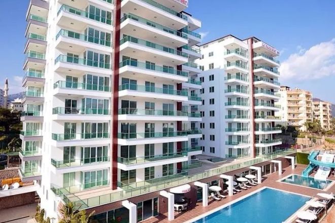 Купить меблированную квартиру 1+1 с видом на море в Тосмуре — 55 м²