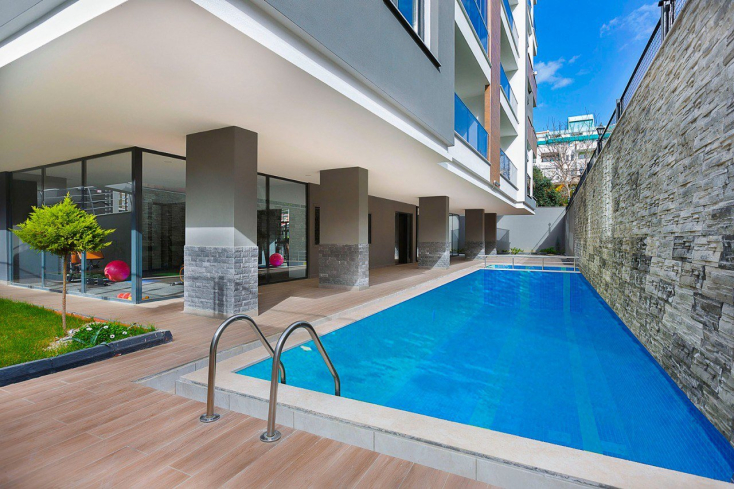 Апартаменты с ярким и стильным интерьером в Махмутлар, всего в 300 метрах от моря