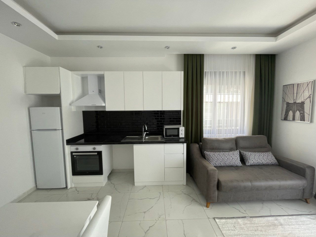 Аренда для отдыха квартиры 1+1 с красивым интерьером в Махмутлар