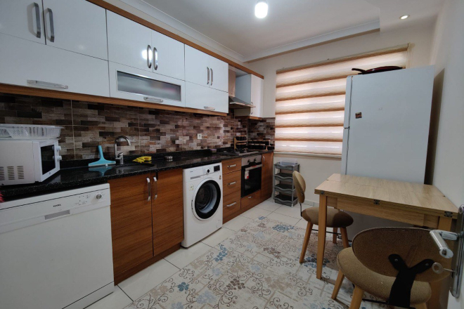 Продажа трехкомнатной квартиры с отдельной кухней в популярном районе Алании - Махмутлар