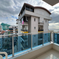 Трехкомнатная меблированная квартира на высоком этаже с видом на море в Махмутларе