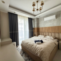 Просторная квартира 2+1 с панорамным видом на море в самом центре Махмутлара!