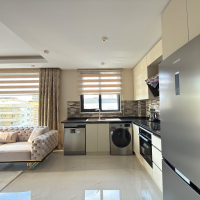 Просторная квартира 2+1 с панорамным видом на море в самом центре Махмутлара!