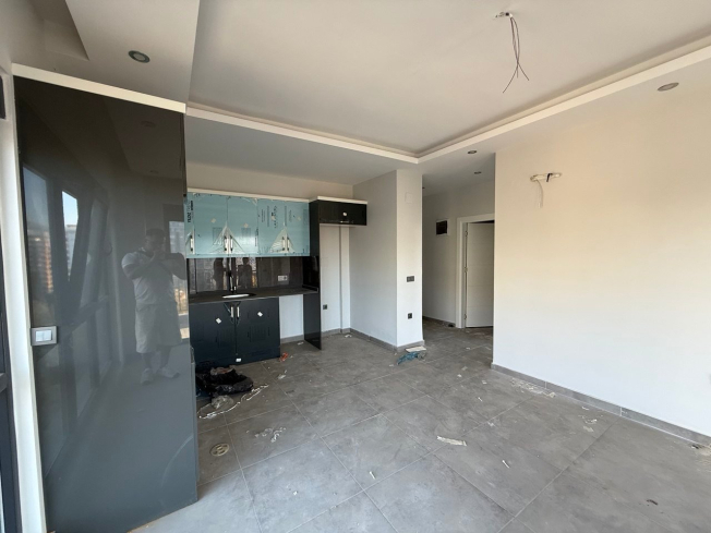 Современная квартира 1+1 с видом на море и горы в Махмутларе по выгодной цене