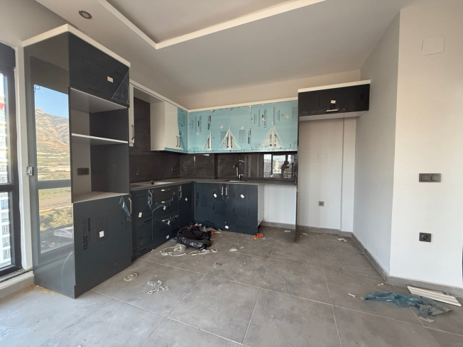 Современная квартира 1+1 с видом на море и горы в Махмутларе по выгодной цене