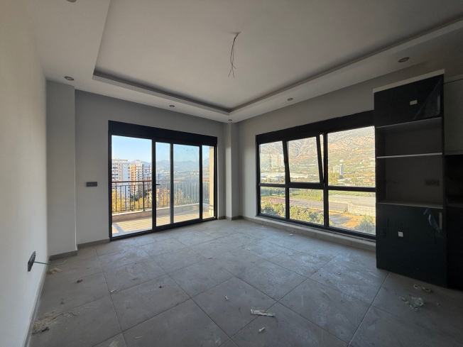 Современная квартира 1+1 с видом на море и горы в Махмутларе по выгодной цене