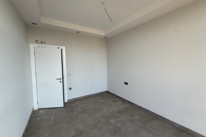 Современная квартира 1+1 с видом на море и горы в Махмутларе по выгодной цене