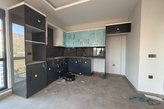 Современная квартира 1+1 с видом на море и горы в Махмутларе по выгодной цене