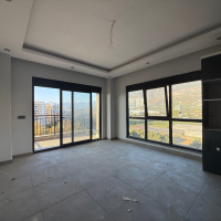 Современная квартира 1+1 с видом на море и горы в Махмутларе по выгодной цене