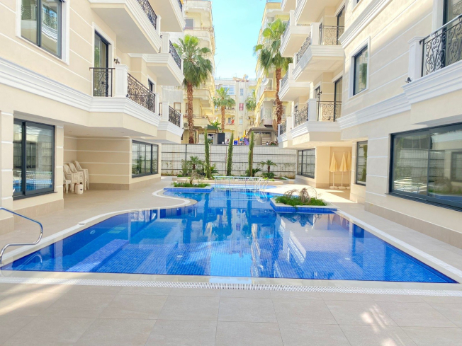 Стильные апартаменты 1+1 с мебелью в 4 минутах от пляжа – идеальны для жизни и аренды