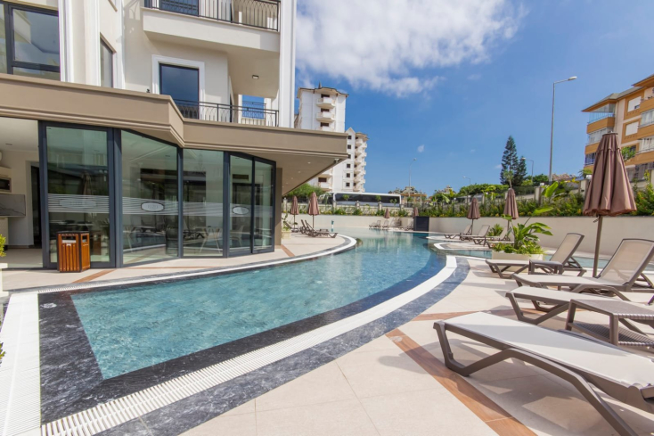 Меблированная 1+1 у моря в престижном районе c возможностью получения  ВНЖ