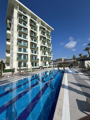 1+1 Уютная квартира 1+1 в новом комплексе в Демирташе. Полностью меблирована. Богатая инфраструктура