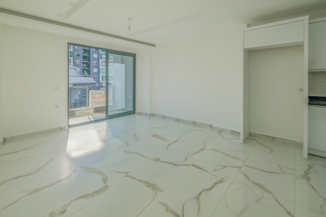 Современная квартира 1+1 рядом с морем и развитой инфраструктурой в Махмутларе