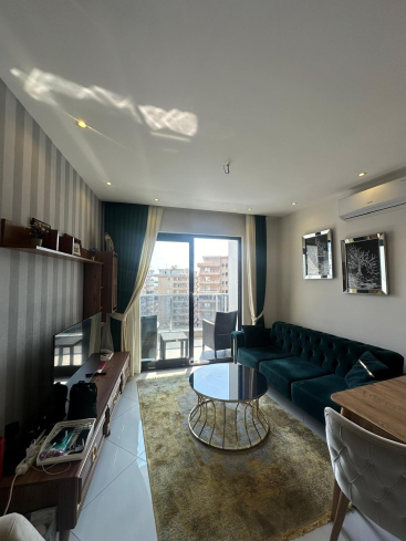 Меблированная 1+1 рядом с морем и полным отельным сервисом в центре Махмутлара