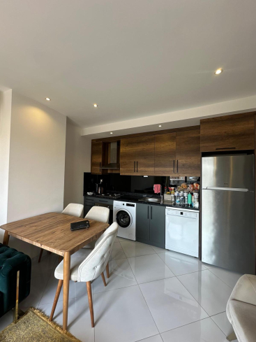 Меблированная 1+1 рядом с морем и полным отельным сервисом в центре Махмутлара