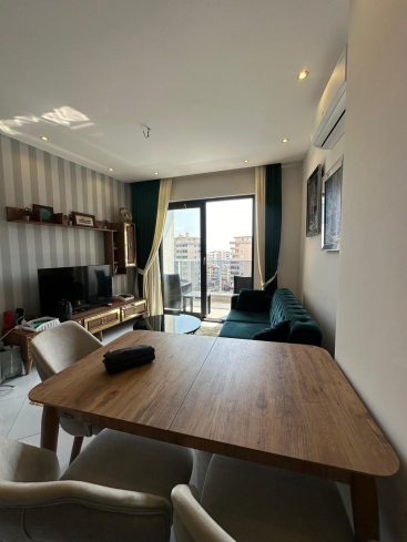 Меблированная 1+1 рядом с морем и полным отельным сервисом в центре Махмутлара