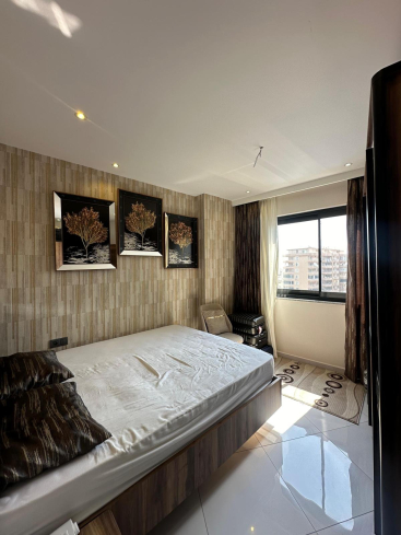 Меблированная 1+1 рядом с морем и полным отельным сервисом в центре Махмутлара