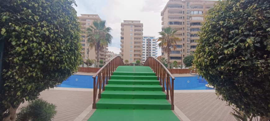 Меблированная 1+1 рядом с морем и полным отельным сервисом в центре Махмутлара