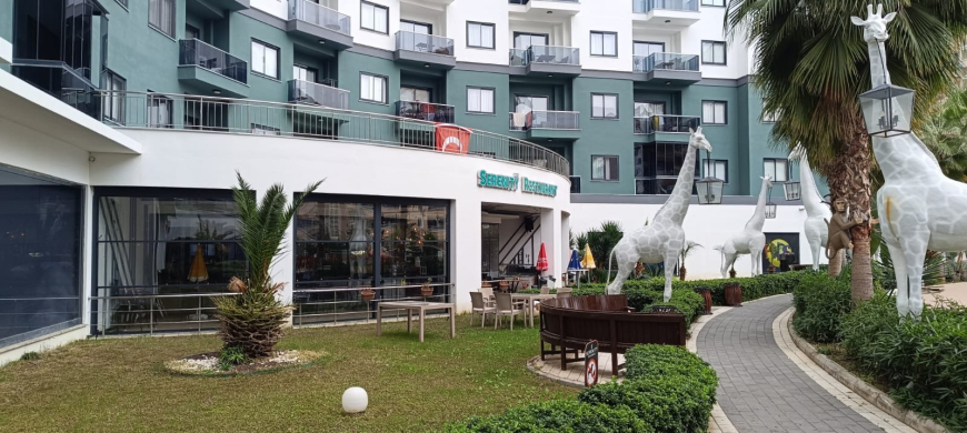 Меблированная 1+1 рядом с морем и полным отельным сервисом в центре Махмутлара