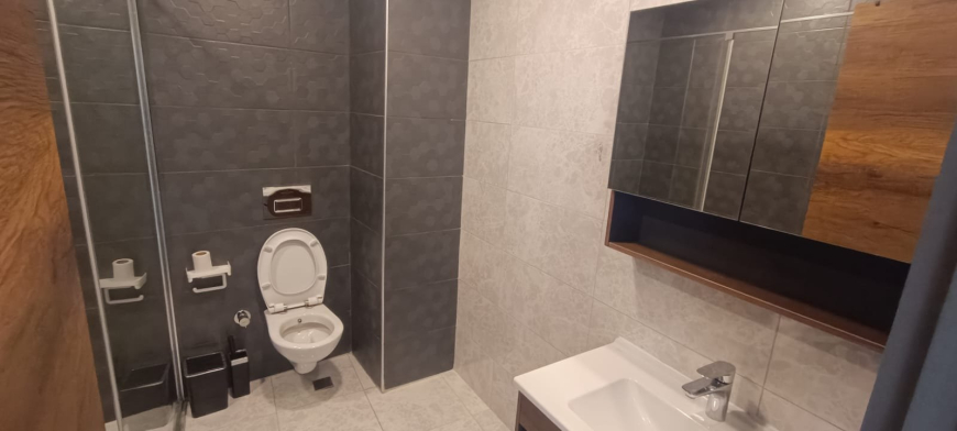 Меблированная 1+1 рядом с морем и полным отельным сервисом в центре Махмутлара