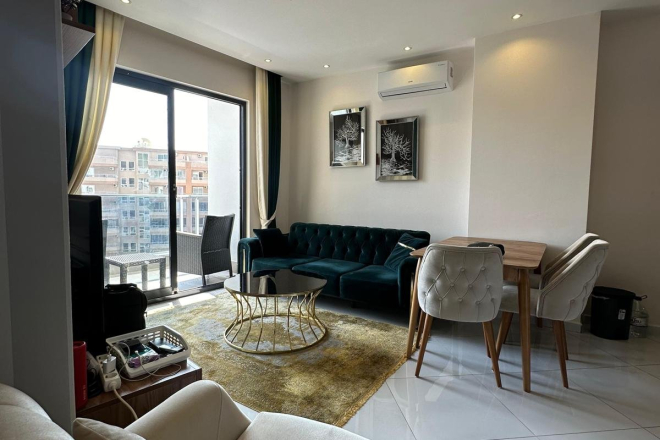 Меблированная 1+1 рядом с морем и полным отельным сервисом в центре Махмутлара