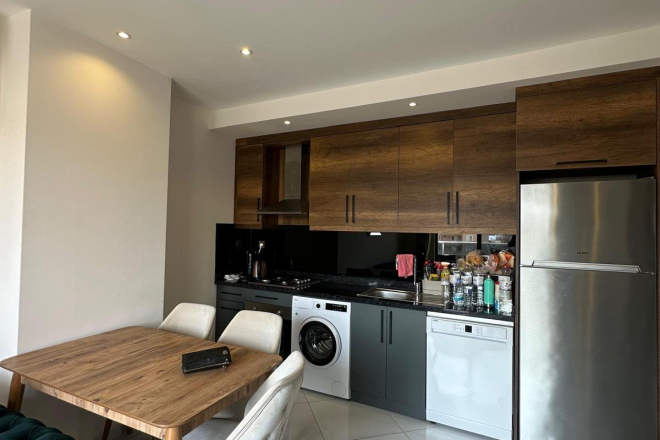 Меблированная 1+1 рядом с морем и полным отельным сервисом в центре Махмутлара