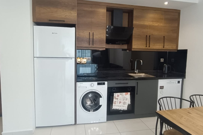 Меблированная 1+1 рядом с морем и полным отельным сервисом в центре Махмутлара