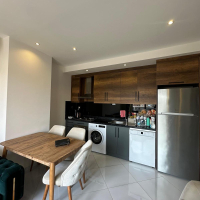 Меблированная 1+1 рядом с морем и полным отельным сервисом в центре Махмутлара