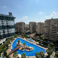 Меблированная 1+1 рядом с морем и полным отельным сервисом в центре Махмутлара