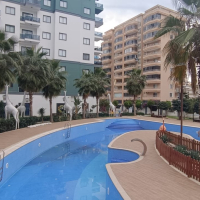 Меблированная 1+1 рядом с морем и полным отельным сервисом в центре Махмутлара