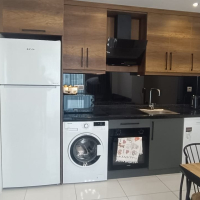 Меблированная 1+1 рядом с морем и полным отельным сервисом в центре Махмутлара