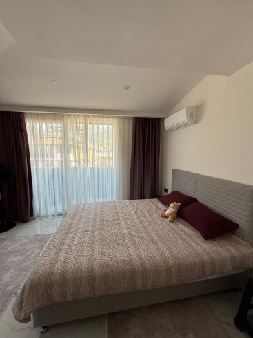 Просторная 2+1 с мебелью и бассейном в центре Аланьи — для жизни и ВНЖ