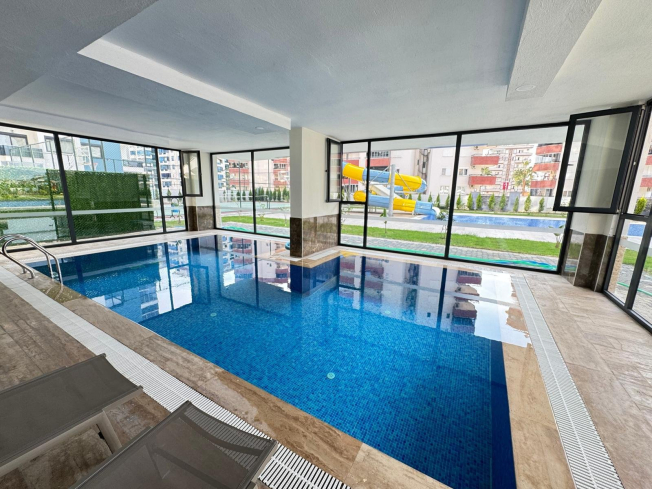 Просторная 1+1 в Махмутларе с курортной инфраструктурой и 500 м до моря