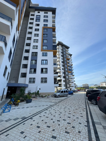 Просторная 1+1 в Махмутларе с курортной инфраструктурой и 500 м до моря