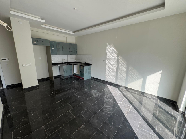 Просторная 1+1 в Махмутларе с курортной инфраструктурой и 500 м до моря