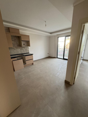 Новая 1+1 в Махмутларе с богатой инфраструктурой и шаговой доступностью к морю