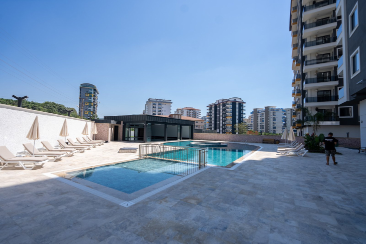 Новая 1+1 в Махмутларе с богатой инфраструктурой и шаговой доступностью к морю