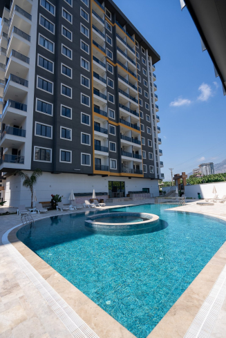 Новая 1+1 в Махмутларе с богатой инфраструктурой и шаговой доступностью к морю