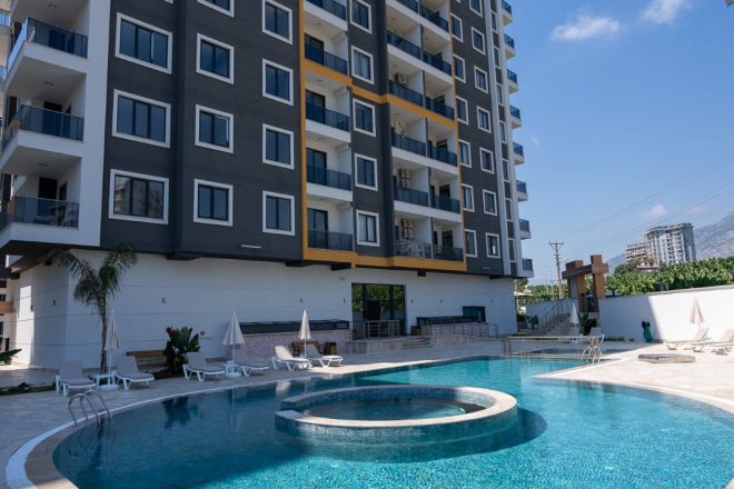 Новая 1+1 в Махмутларе с богатой инфраструктурой и шаговой доступностью к морю