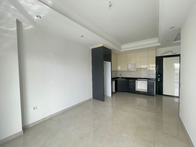 Современная 1+1 в Махмутларе с отельной инфраструктурой и потенциалом аренды