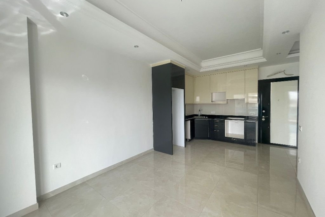 Современная 1+1 в Махмутларе с отельной инфраструктурой и потенциалом аренды