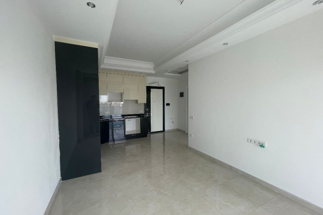 Современная 1+1 в Махмутларе с отельной инфраструктурой и потенциалом аренды