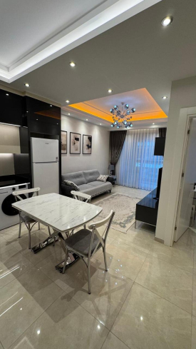 Современная 1+1 с отельной инфраструктурой и высоким арендным потенциалом в Махмутларе