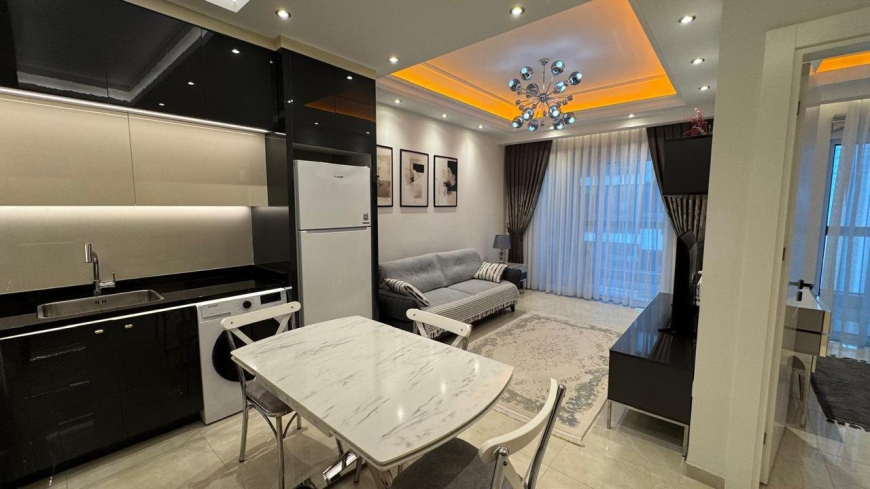 Современная 1+1 с отельной инфраструктурой и высоким арендным потенциалом в Махмутларе