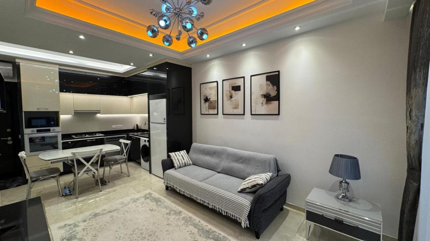 Современная 1+1 с отельной инфраструктурой и высоким арендным потенциалом в Махмутларе