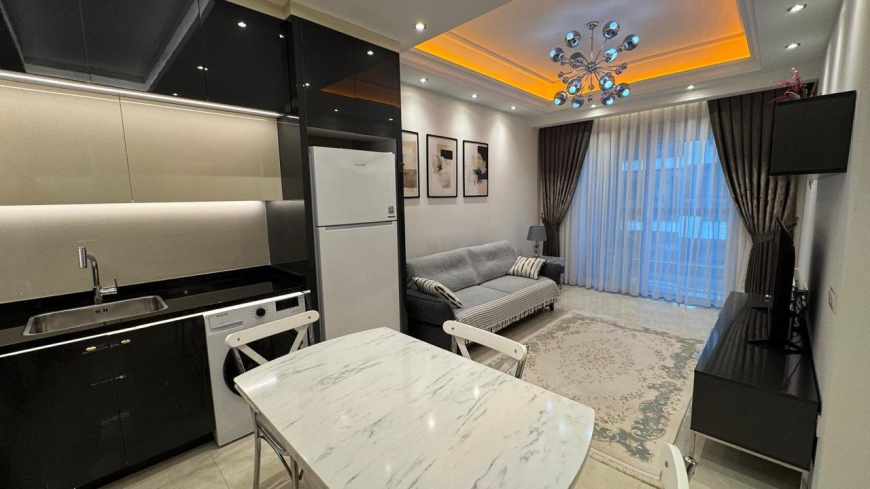 Современная 1+1 с отельной инфраструктурой и высоким арендным потенциалом в Махмутларе