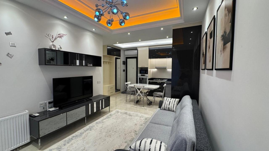 Современная 1+1 с отельной инфраструктурой и высоким арендным потенциалом в Махмутларе