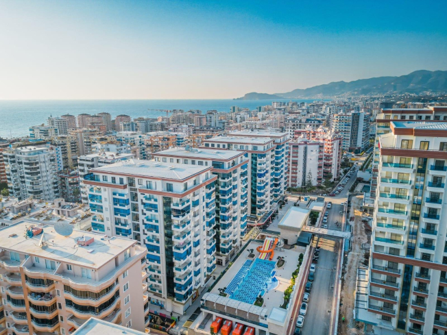 Современная 1+1 с отельной инфраструктурой и высоким арендным потенциалом в Махмутларе