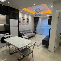 Современная 1+1 с отельной инфраструктурой и высоким арендным потенциалом в Махмутларе