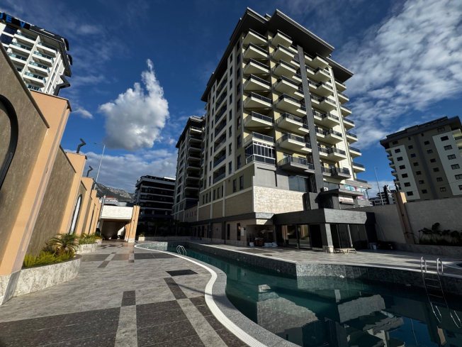 Просторная 2+1 в новом доме в Махмутларе — идеальна для жизни и аренды